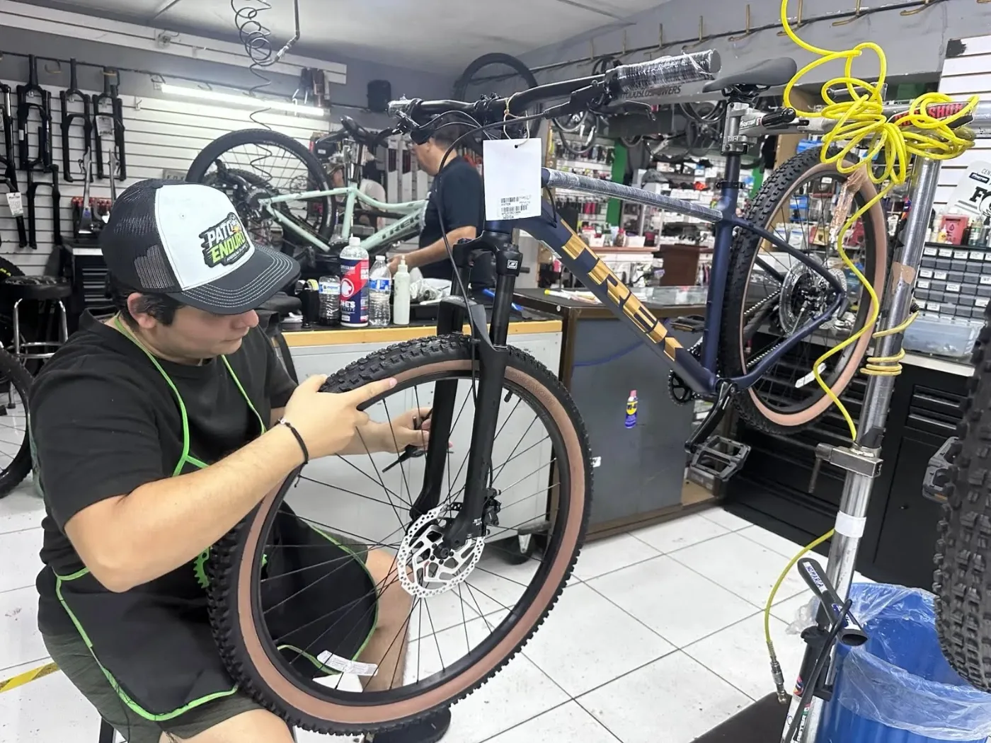 A MASTER BIKES technician assembling a Trek Marlin 5 bike