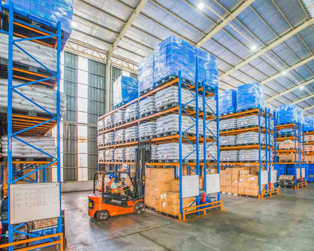 Commercial goods on pallet racking, staged for delivery